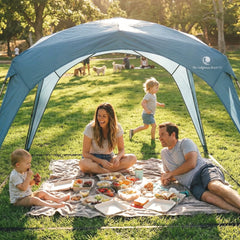 Family enjoying a picnic under the Pop 'N Go Canopy, providing outdoor shade and UV protection.