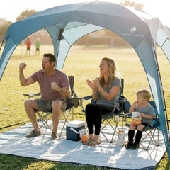 Family enjoying a picnic under the Pop 'N Go Canopy, showcasing outdoor shade and comfort.