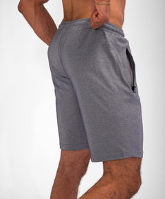Model wearing Urban Stride All-Day Wear Shorts from behind, showcasing tall fit, comfort, and modern streetwear style.
