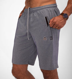 Model wearing Urban Stride All-Day Wear Shorts from behind, showcasing tall fit, comfort, and modern streetwear style.