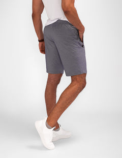 Model wearing Urban Stride All-Day Wear Shorts from behind, showcasing tall fit, comfort, and modern streetwear style.