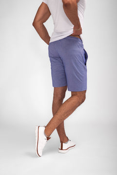 Model wearing Urban Stride All-Day Wear Shorts from behind, showcasing tall fit, comfort, and modern streetwear style.