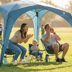 Family enjoying a picnic under the Pop 'N Go Canopy, showcasing outdoor shade and comfort.
