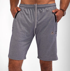 Model wearing Urban Stride All-Day Wear Shorts from behind, showcasing tall fit, comfort, and modern streetwear style.