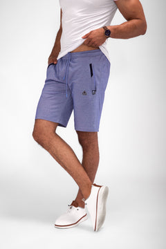 Model wearing Urban Stride All-Day Wear Shorts from behind, showcasing tall fit, comfort, and modern streetwear style.