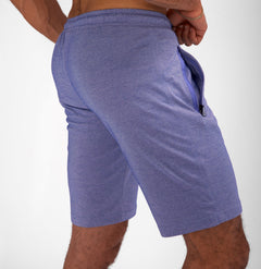 Model wearing Urban Stride All-Day Wear Shorts from behind, showcasing tall fit, comfort, and modern streetwear style.