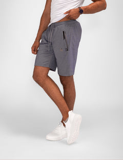 Model wearing Urban Stride All-Day Wear Shorts from behind, showcasing tall fit, comfort, and modern streetwear style.