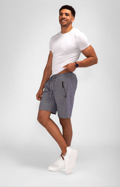 Model wearing Urban Stride All-Day Wear Shorts from behind, showcasing tall fit, comfort, and modern streetwear style.
